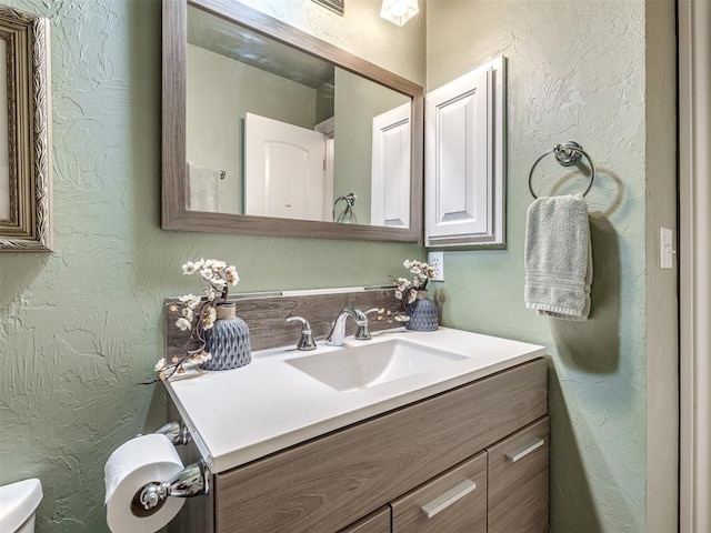 17213 Sunny Hollow Rd, Edmond, OK 73012 - half bathroom with vanity and a textured wall