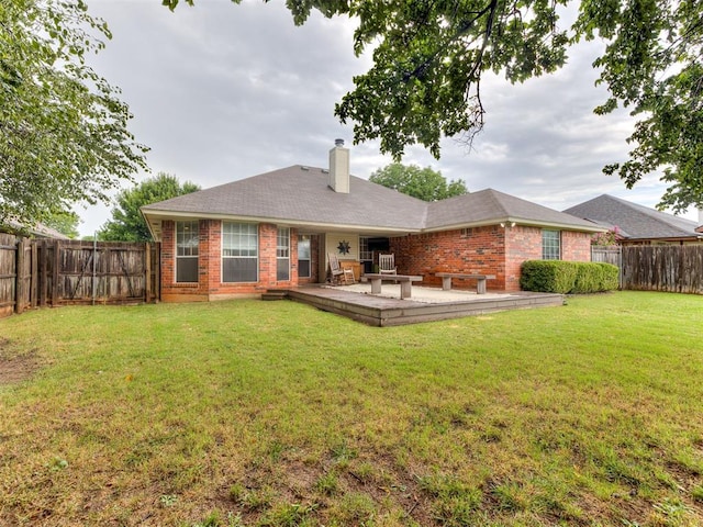17213 Sunny Hollow Rd, Edmond, OK 73012 - back of house featuring brick siding, a fenced backyard, and a chimney
