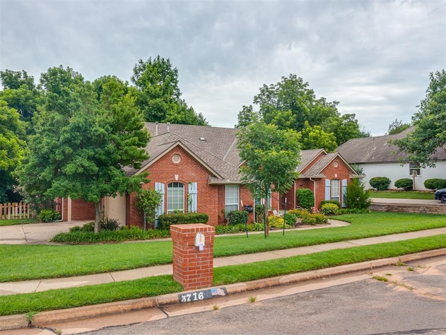 3716 Equestrian Ct, Edmond, OK 73034 - view of front of home with brick siding, roof with shingles, and driveway