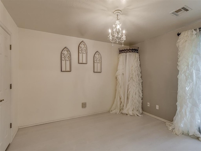 3716 Equestrian Ct, Edmond, OK 73034 - spare room with a chandelier and wood finished floors