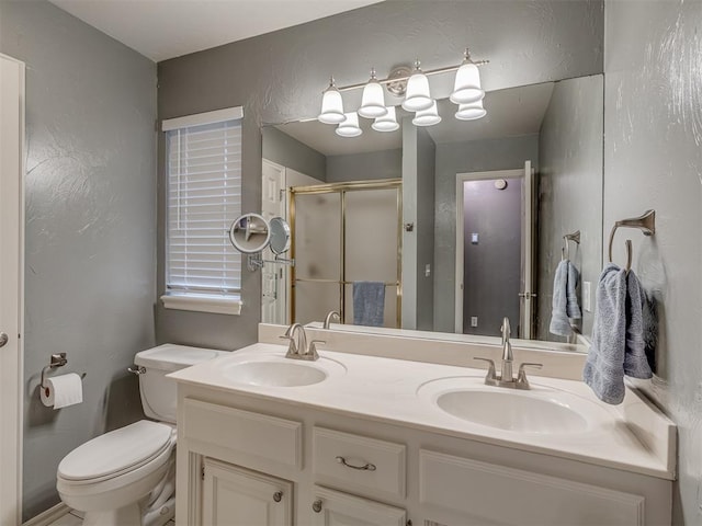 3716 Equestrian Ct, Edmond, OK 73034 - bathroom with a stall shower, double vanity, and a textured wall