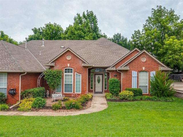 3716 Equestrian Ct, Edmond, OK 73034 - view of front of property featuring brick siding, a shingled roof, and a front yard