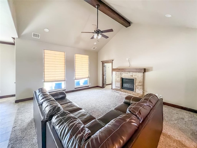 2010 Lakewood, Seminole, OK 74868 - living room featuring ceiling fan, beam ceiling, a stone fireplace, carpet, and high vaulted ceiling
