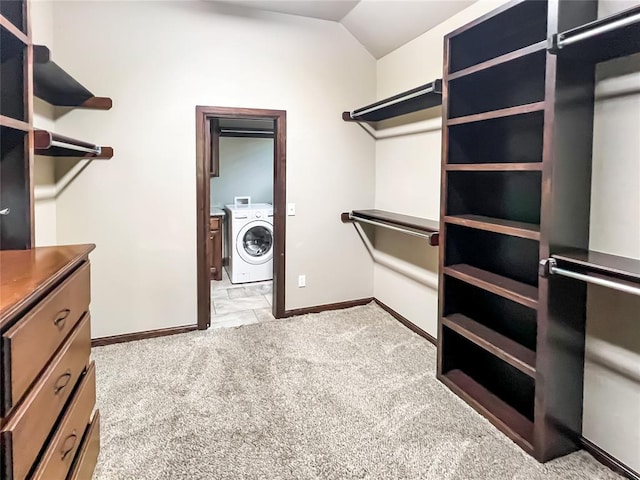 2010 Lakewood, Seminole, OK 74868 - spacious closet featuring washer / clothes dryer, light colored carpet, and lofted ceiling