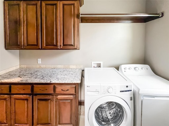 2010 Lakewood, Seminole, OK 74868 - washroom featuring cabinet space and independent washer and dryer