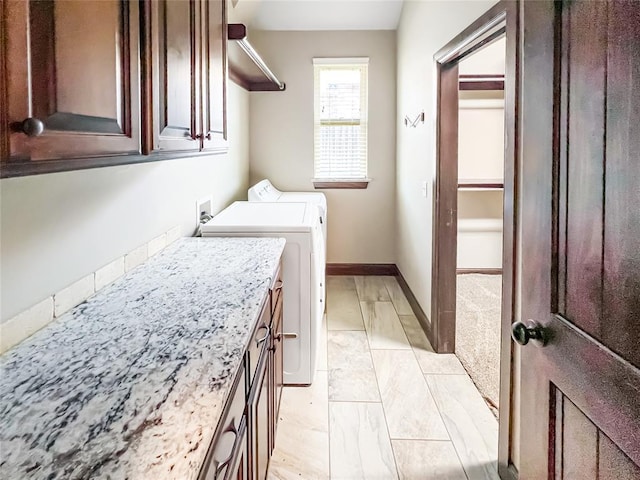 2010 Lakewood, Seminole, OK 74868 - laundry area featuring cabinet space and washer and dryer