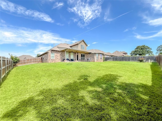 2010 Lakewood, Seminole, OK 74868 - rear view of property featuring brick siding and a fenced backyard