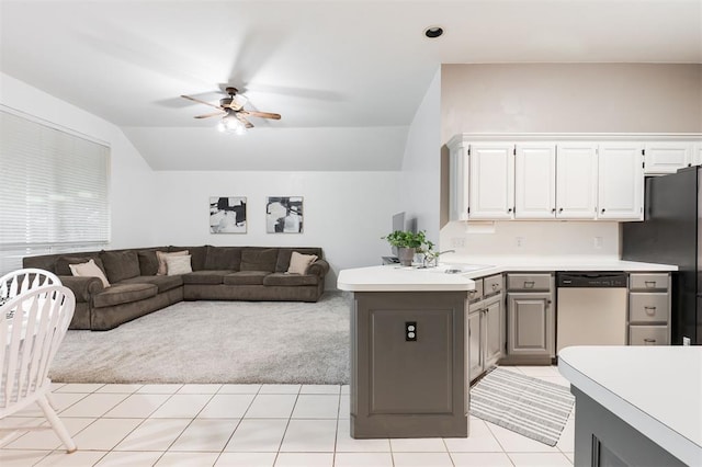 14213 Pecan Hollow Ter, Edmond, OK 73013 - kitchen featuring appliances with stainless steel finishes, a ceiling fan, vaulted ceiling, light countertops, and white cabinets