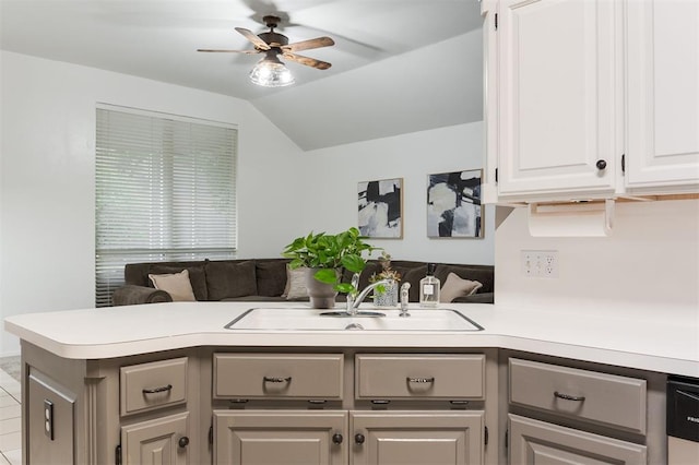 14213 Pecan Hollow Ter, Edmond, OK 73013 - kitchen featuring a peninsula, ceiling fan, open floor plan, light countertops, and vaulted ceiling