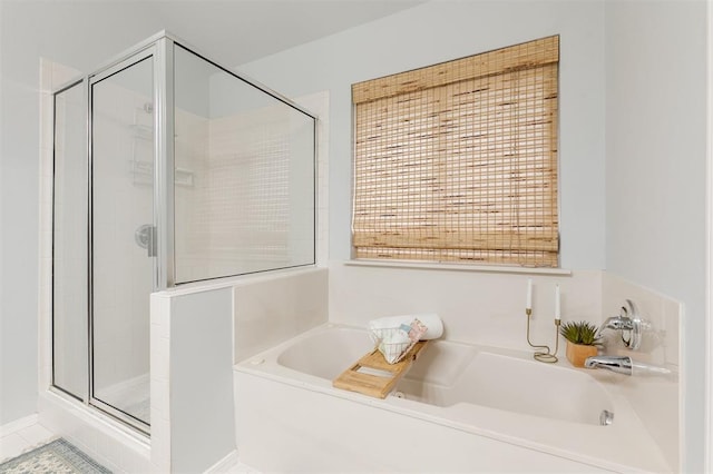 14213 Pecan Hollow Ter, Edmond, OK 73013 - bathroom featuring a stall shower and a bath