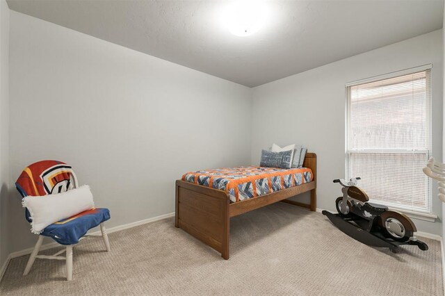 14213 Pecan Hollow Ter, Edmond, OK 73013 - bedroom with light colored carpet