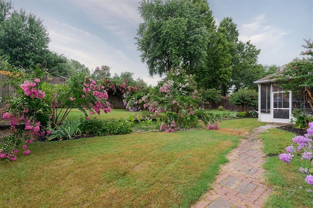 14213 Pecan Hollow Ter, Edmond, OK 73013 - view of yard featuring a sunroom