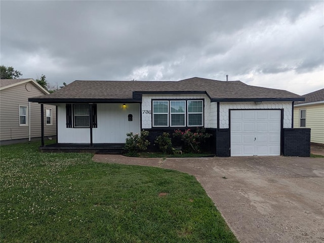 733 E Steed Dr, Midwest City, OK 73110 - view of front of home with a garage, a front lawn, concrete driveway, covered porch, and brick siding