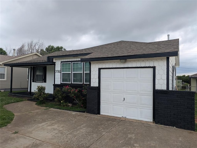 733 E Steed Dr, Midwest City, OK 73110 - single story home with roof with shingles, driveway, a garage, and brick siding