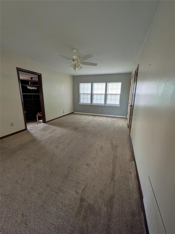 733 E Steed Dr, Midwest City, OK 73110 - unfurnished room with carpet floors and a ceiling fan