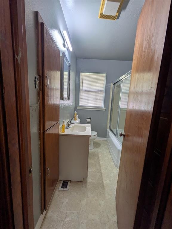 733 E Steed Dr, Midwest City, OK 73110 - bathroom featuring vanity and combined bath / shower with glass door
