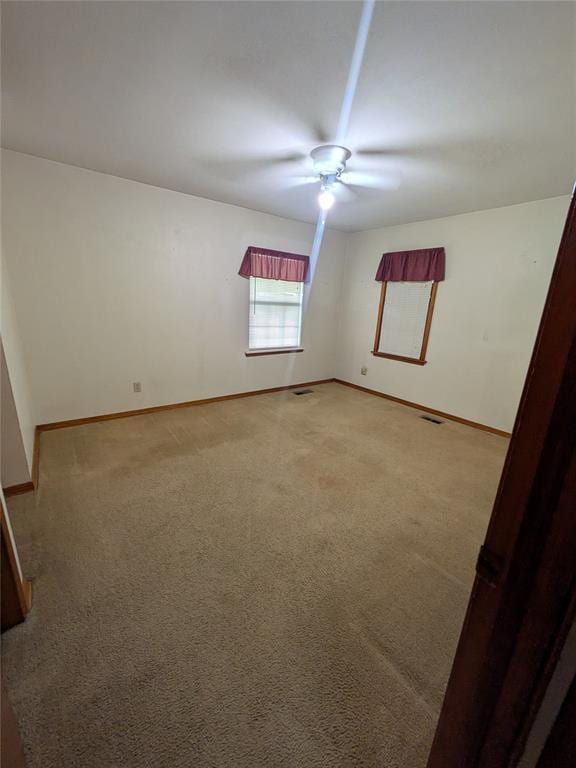 733 E Steed Dr, Midwest City, OK 73110 - unfurnished room featuring a ceiling fan and light colored carpet