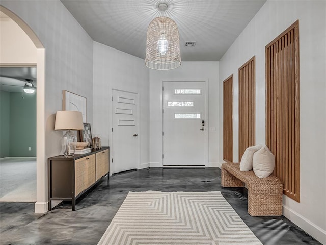 3604 Valley Creek Cir, Edmond, OK 73034 - foyer entrance with arched walkways and finished concrete floors
