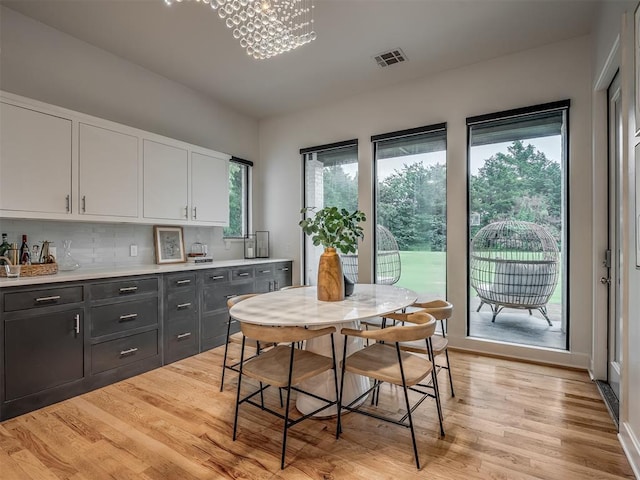 3604 Valley Creek Cir, Edmond, OK 73034 - dining area featuring light wood-type flooring