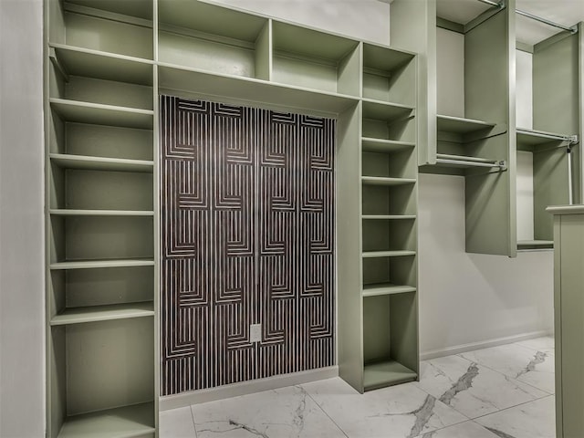 3604 Valley Creek Cir, Edmond, OK 73034 - spacious closet featuring marble finish floors