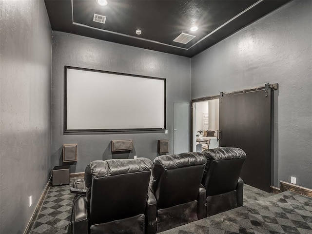 3604 Valley Creek Cir, Edmond, OK 73034 - home theater room featuring a textured wall and a barn door
