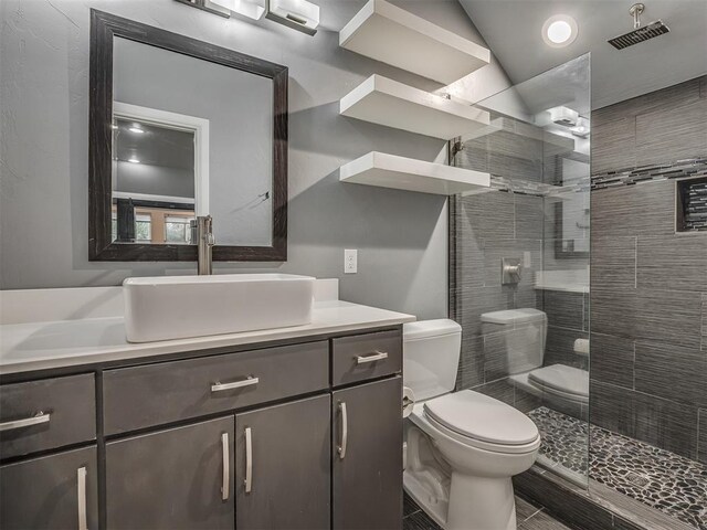 3604 Valley Creek Cir, Edmond, OK 73034 - full bathroom featuring vanity and a walk in shower