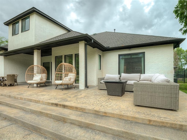 3604 Valley Creek Cir, Edmond, OK 73034 - rear view of house featuring an outdoor living space, brick siding, a patio, and roof with shingles