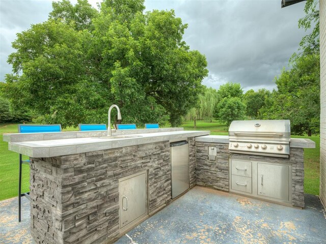 3604 Valley Creek Cir, Edmond, OK 73034 - view of patio featuring exterior kitchen and a sink