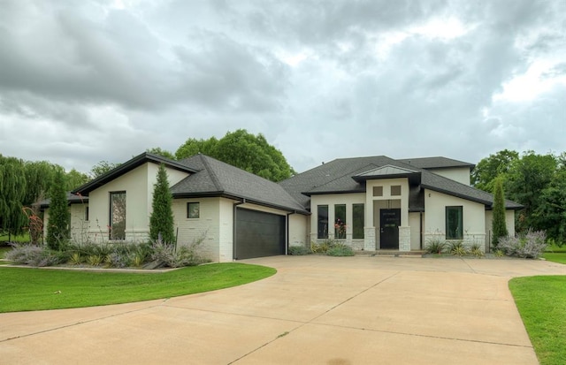 3604 Valley Creek Cir, Edmond, OK 73034 - view of front of home with driveway, a garage, stone siding, a front yard, and stucco siding