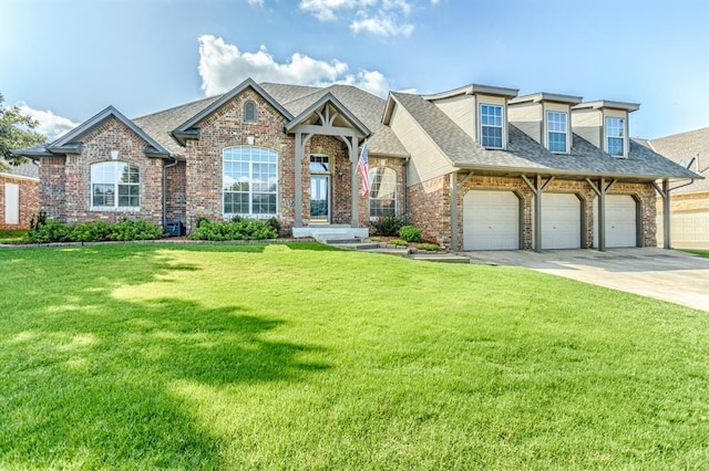2525 Steeplechase Rd, Edmond, OK 73034 - view of front of house featuring brick siding, a front yard, driveway, and a shingled roof