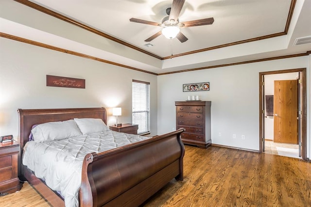 2525 Steeplechase Rd, Edmond, OK 73034 - bedroom featuring a raised ceiling, ornamental molding, wood finished floors, and ceiling fan