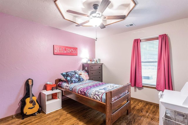 2525 Steeplechase Rd, Edmond, OK 73034 - bedroom featuring wood finished floors and ceiling fan