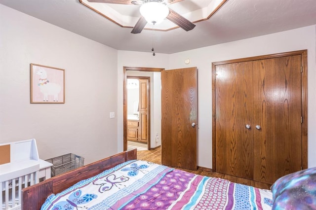 2525 Steeplechase Rd, Edmond, OK 73034 - bedroom with light wood-style floors and a ceiling fan