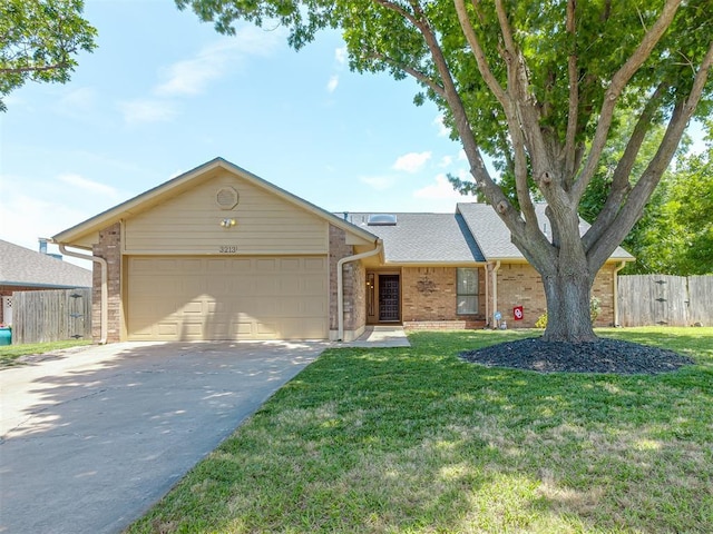 3213 Creekwood Ct, Norman, OK 73072 - view of front of property featuring brick siding, a garage, driveway, and roof with shingles