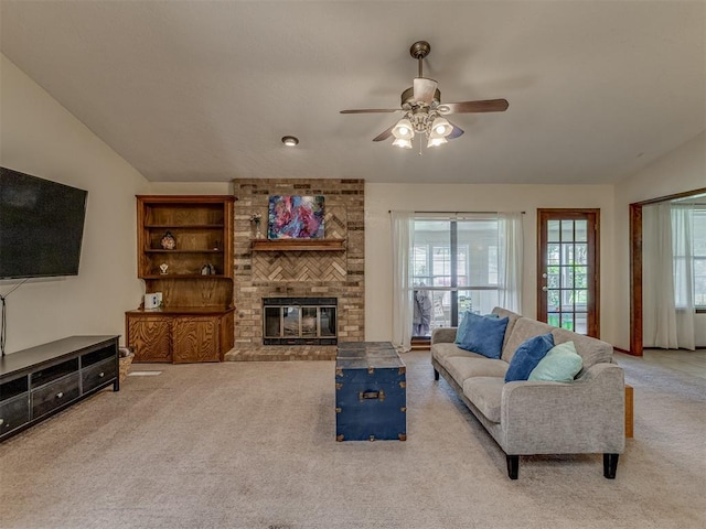 3213 Creekwood Ct, Norman, OK 73072 - living area with carpet floors, lofted ceiling, ceiling fan, and a fireplace