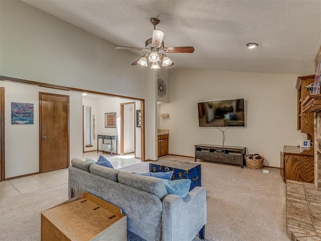 3213 Creekwood Ct, Norman, OK 73072 - living room featuring lofted ceiling, a ceiling fan, light colored carpet, and a textured ceiling