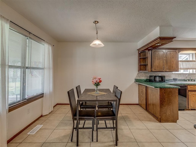 3213 Creekwood Ct, Norman, OK 73072 - dining room with light tile patterned floors and baseboards