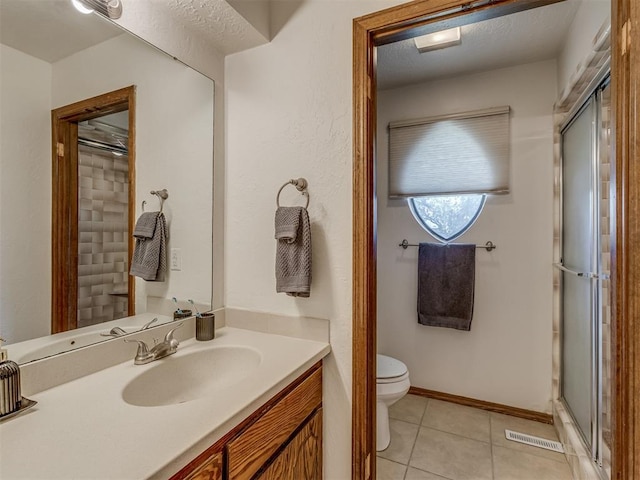 3213 Creekwood Ct, Norman, OK 73072 - full bathroom featuring tile patterned floors, a shower stall, and vanity
