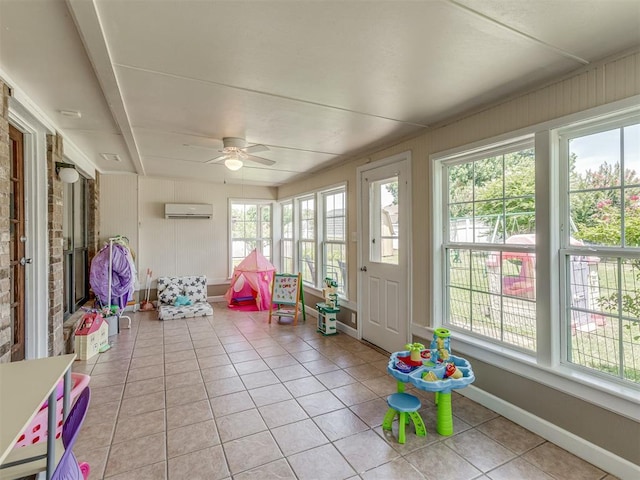 3213 Creekwood Ct, Norman, OK 73072 - sunroom with a wall mounted AC, tile patterned floors, and a ceiling fan