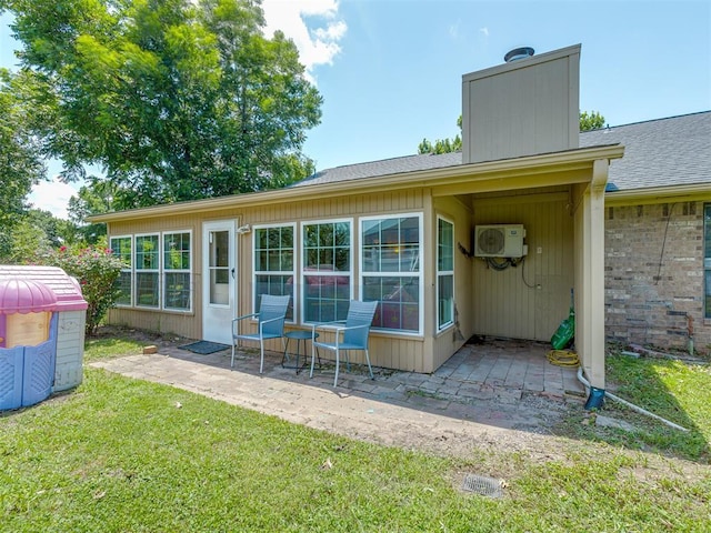 3213 Creekwood Ct, Norman, OK 73072 - rear view of house featuring a patio area, a lawn, a shingled roof, and a chimney