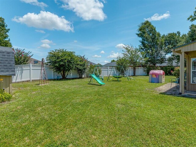 3213 Creekwood Ct, Norman, OK 73072 - fenced backyard featuring a playground
