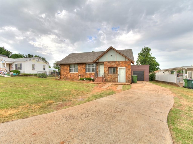 1016 Maple Ave, Yukon, OK 73099 - view of front of home with driveway, stone siding, and an attached garage