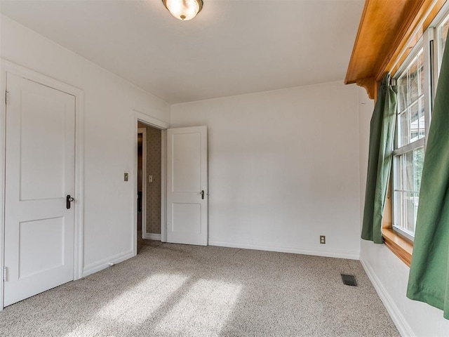 1016 Maple Ave, Yukon, OK 73099 - unfurnished room featuring baseboards and carpet flooring