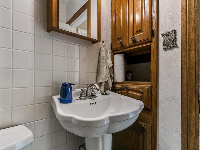 1016 Maple Ave, Yukon, OK 73099 - half bath with tile walls and decorative backsplash