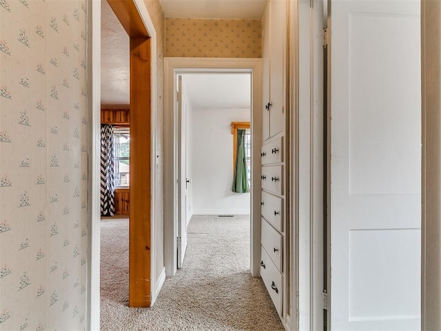 1016 Maple Ave, Yukon, OK 73099 - hallway with light colored carpet and wallpapered walls