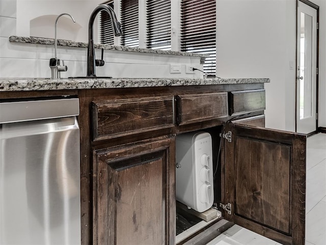 18501 El Greco Dr, Edmond, OK 73012 - detailed view of stainless steel dishwasher and dark brown cabinetry