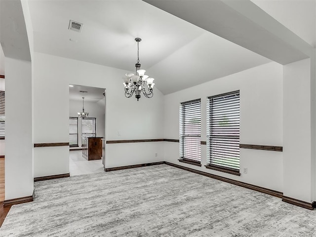 18501 El Greco Dr, Edmond, OK 73012 - empty room featuring a chandelier, plenty of natural light, wood finished floors, and lofted ceiling
