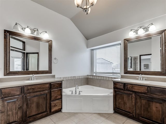 18501 El Greco Dr, Edmond, OK 73012 - full bathroom with lofted ceiling, tile patterned flooring, two vanities, and a bath
