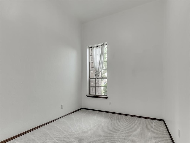18501 El Greco Dr, Edmond, OK 73012 - empty room with light colored carpet and baseboards