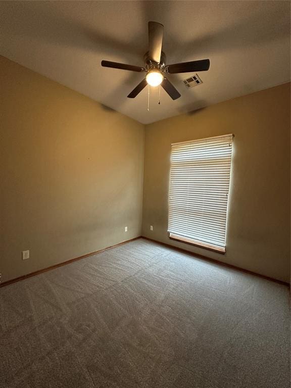 712 N Cherokee Way, Mustang, OK 73064 - spare room with carpet floors and a ceiling fan